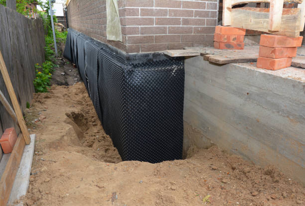 Happy homeowners after waterproofing job in Oliver Springs